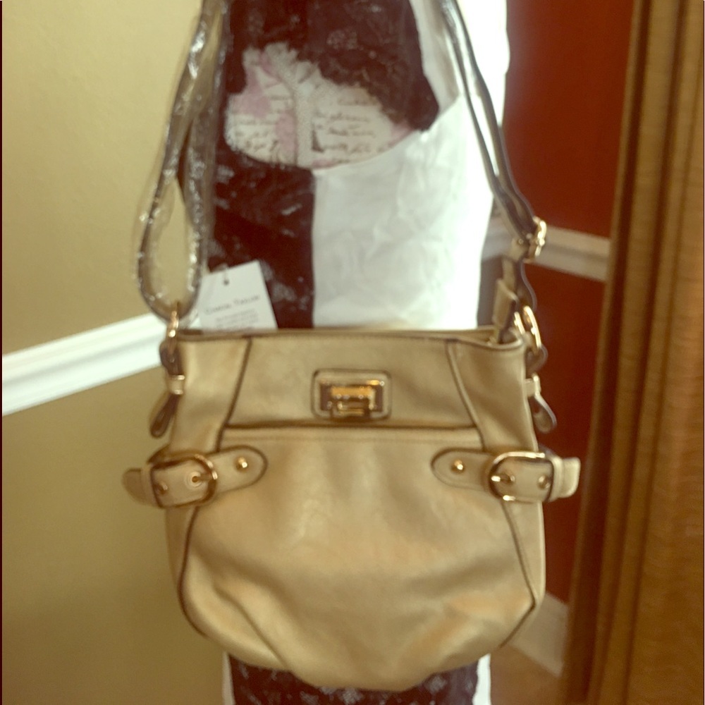 A gold Cross body purse. NWT